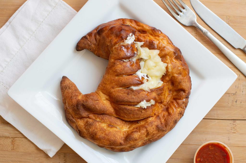 Cheese And Ricotta Calzone · Served with marinara sauce. Add toppings for additional charges.