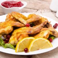Lemon Pepper Chicken Wings · Mouthwatering Chicken wings, tossed in a Lemon Pepper sauce and fried to perfection. Served ...