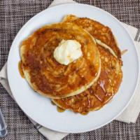 Cinnamon Roll Pancakes · Pancakes topped with cream cheese icing.