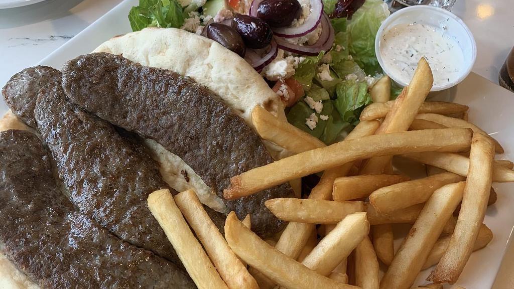 Open Gyro Platter · (Beef or chicken or falafel) served with greek salad, french fries, and pita bread.