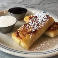 Blintzes · Filled with farmer cheese. Order them hot to eat now, or cold to cook at home later. Hot bli...