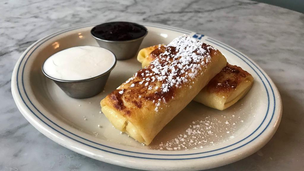Blintzes · Filled with farmer cheese. Order them hot to eat now, or cold to cook at home later. Hot blintzes come with blueberry compote and sour cream on the side, cold blintzes do not. (contains dairy, gluten).