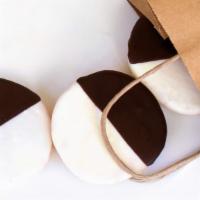 Black & White Cookie · Russ & Daughters bakes the best black & white cookie in New York! The cookie itself is delic...