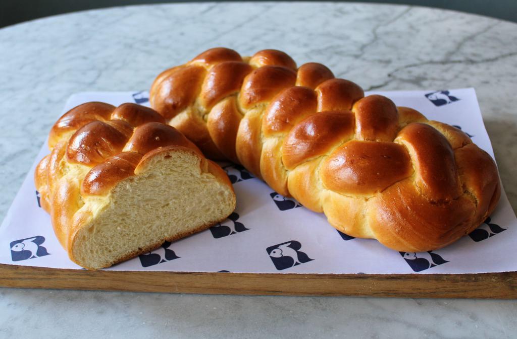 Challah · We bake all of our breads every day at Russ & Daughters Bagels & Bakery. Russ & Daughters bakes the most traditional challah. Perfect for your holiday celebration or Shabbat table, or any time you want a taste of tradition. (Sorry, we cannot slice it for you.)