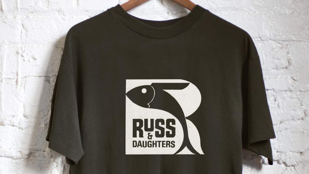Vintage Logo T-Shirt · Wear a piece of history with Russ & Daughters’ vintage logo t-shirts. On the front; a logo drawn by a customer in the 1970’s. An excellent gift for all of our fans — young and old. 100% cotton. (no returns or exchanges)