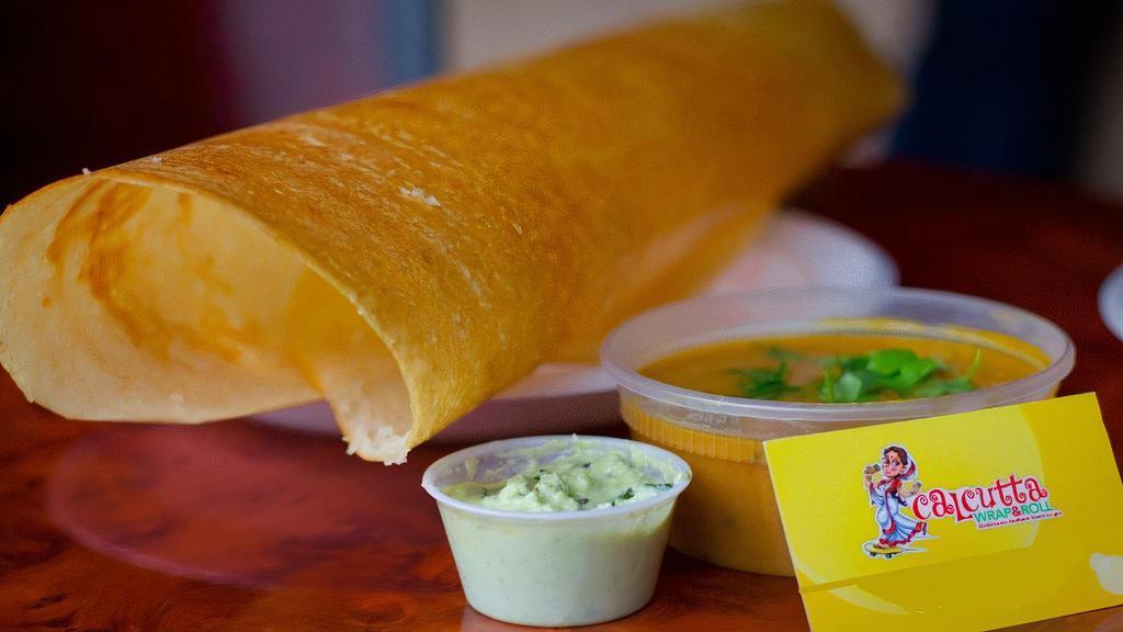Plain Dosa · Gluten-free. Paper dosa. Paper-thin, crispy rice crepe. Served with coconut chutney and sambar (lentil soup).