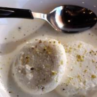 Rosomalai (2) · Homemade cheese discs soaked in thickened milk & garnished with cardamom & pistachio.