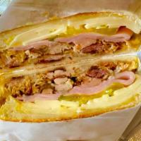 Cuban Sandwich · 12-Hour Smoked tender Pork Shoulder with premium Spanish Ham, Swiss Cheese, Pickles and Must...