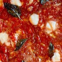 Cheese Pie · tomato sauce, shredded mozzarella, parmigiano