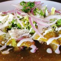 Enchiladas (Verdes/ Rojas)  · Soft corn tortilla stuffed with shredded chicken topped with green tomatillo salsa or red gu...