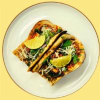 Paneer Tikka Tacos · Garlic naan tortillas, tikka marinated paneer cubes, mozzarella feathers, masala pico de gal...