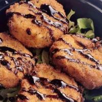 Fried Goat Cheese · Fried goat cheese drizzled with a balsamic glaze