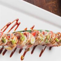 Passion Roll · Spicy Tuna, Salmon, & Yellowtail Topped With Seared Tuna, Sesame Oil, Eel Sauce & Scallion.