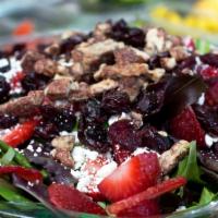 Basil Salad · Strawberry, candied walnuts, goat cheese, and dried cranberries over mesclun with raspberry ...