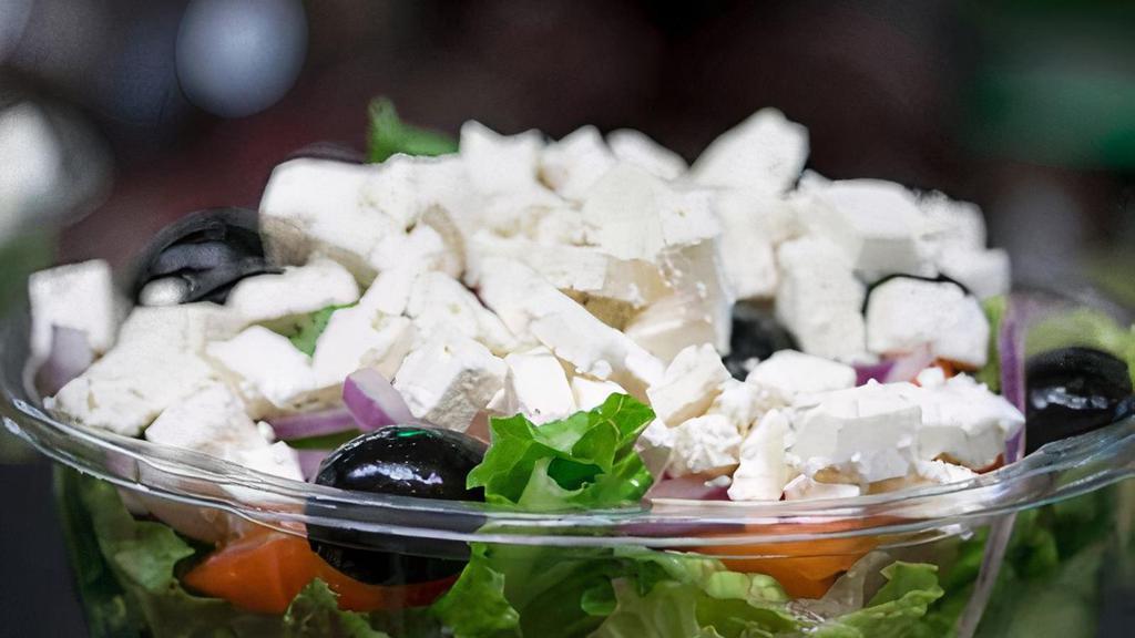 Greek Goddess Salad · Feta cheese, red onion, tomato, and black olives over romaine lettuce with balsamic vinaigrette.