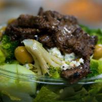 The Green Monster Salad · Green peppers, broccoli, cucumbers, green olives, blue cheese crumbles over romaine with swe...
