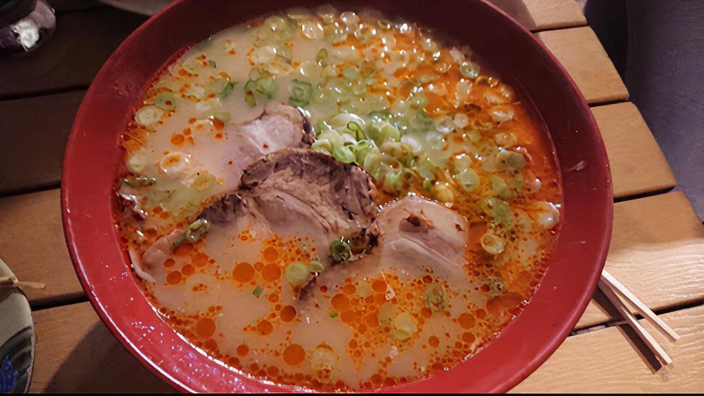 Negi Ramen · Spicy pork broth and ramen noodles with roasted pork bits and extra scallion.