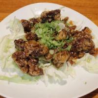 Butabara Kurozu Itame · Deep-fried sweet and sour pork belly.