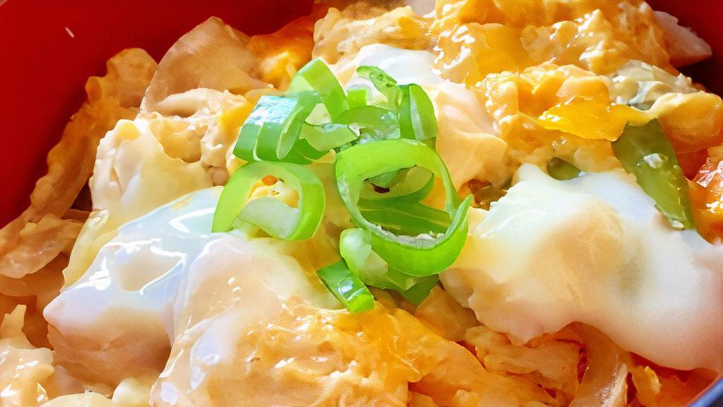 Oyakodon · Chicken and eggs over rice 
served with miso soup.