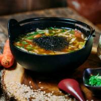 Brown Rice In Soup Bowl · Napa, scallions, carrot, shiitake, ume, and nori in kombu broth.