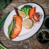 Broiled Wild-Caught Fish · Served with brown rice and a side of steamed vegetables.