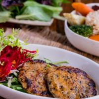 Quinoa-Salmon Patties · Two pan seared patties with steam veggies carrot, broccoli, and Japanese sweet potato and br...
