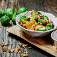 Brussels Sprouts · Popular. Sauteed with sesame oil and topped with peanut sauce and walnuts.