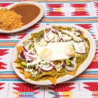 Chilaquiles  · Choice of sauce served over tortilla chips topped w/onion, radish, avocado, sour cream, coti...