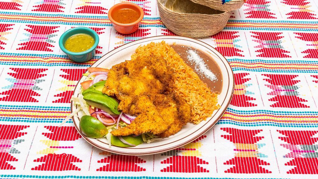 Milanesa De Pollo · Breaded chicken served with salad, refried beans, mexican rice, and 3 handmade tortillas