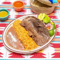 Bistec Asado · Grilled steak served w/refried beans, salad, mexican rice and 3 handmade tortillas
