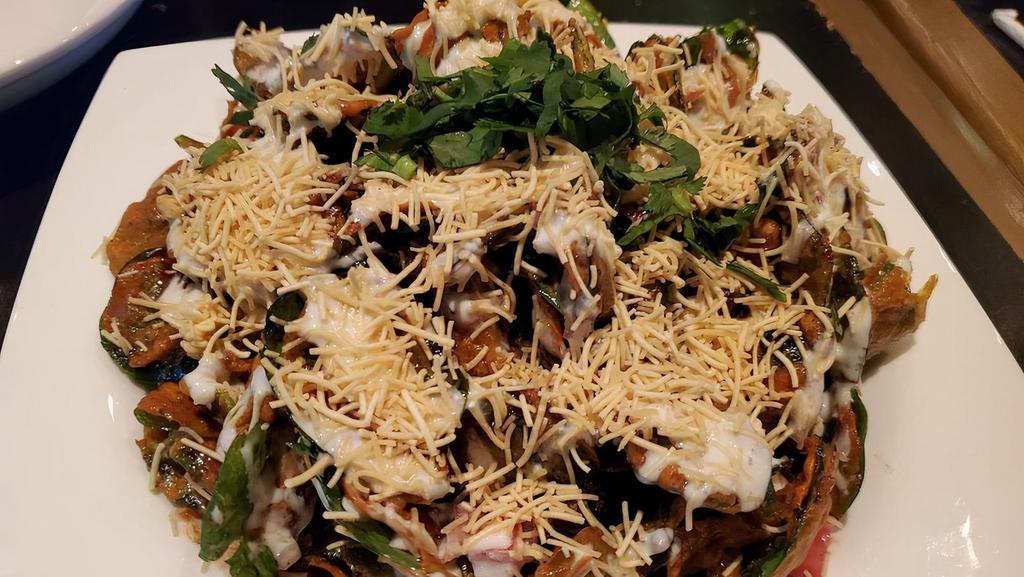 Vegetarian Palak Chaat · Crispy spinach topped with onions, cilantro & tomatoes .