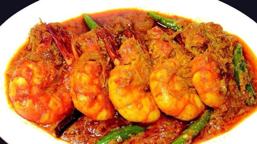 Chingri Malaikari Gravy (Rice Not Included) · Tiger shrimp cooked in coconut milk.