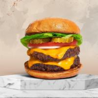 Cheese Double Burger · Two American beef patties topped with melted cheese, buttered lettuce, tomato, onion, and pi...
