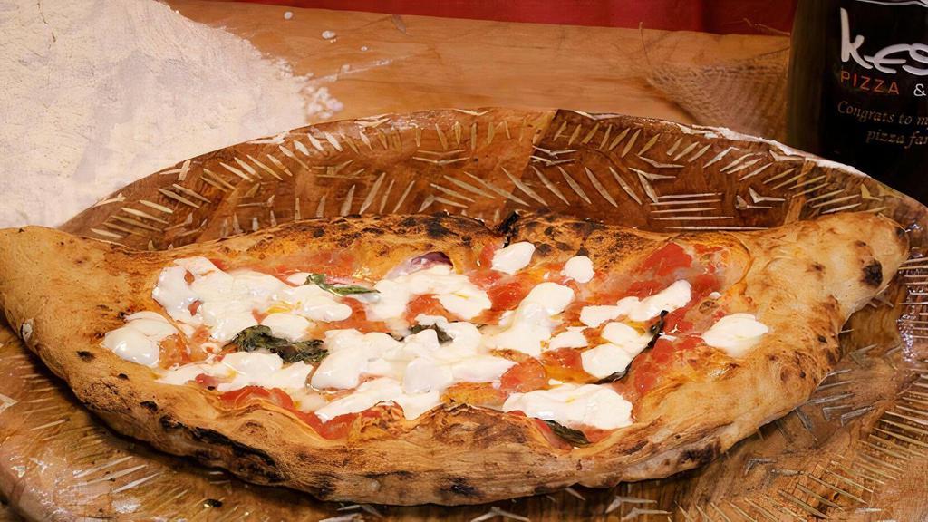 Night And Day Calzone · Inside: fresh ricotta, fresh mozzarella, Italian ham. On Top: tomato sauce, fresh mozzarella, grana, basil, EVOO