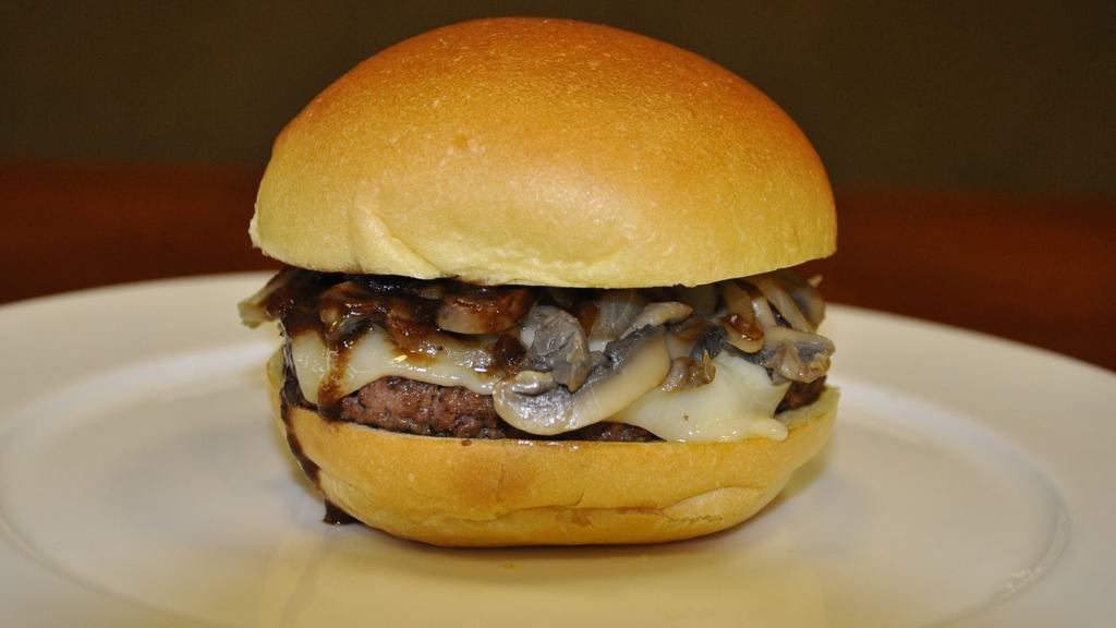 Steak Burger · Beef patty, sautéed mushroom, grilled onions, Swiss cheese and A1 steak sauce.