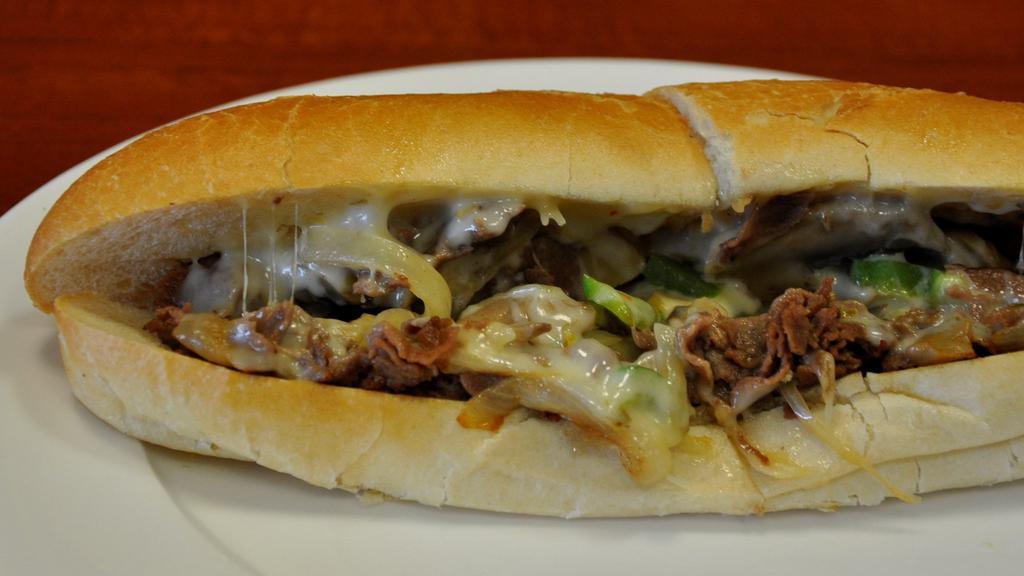 Philly Cheese Steak · Thinly sliced beef steak topped with American cheese, sautéed mushroom, onions and green peppers. Served on a toasted hero bread.