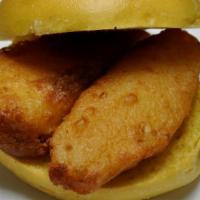 Fish Sandwich · Crispy fried cod fish patties on a toasted bun. Served with tartar sauce.