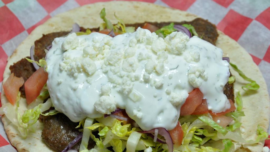 Greek Ranger · Seasoned gyro-styled beef slices, lettuce, tomatoes, onions, crumbled feta cheese and homemade tzatziki sauce. Served on a toasted pita bread.