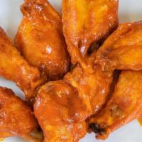 Chicken Wings · Eight jumbo chicken wings with your choice of buffalo, BBQ, or spicy BBQ sauce.  Blue cheese...