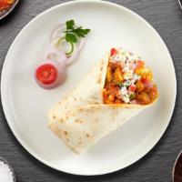 Pasanda Vision Burrito · Cheese cubes marinated in yogurt and spices cooked in tomato sauce wrapped in a warm Naan.