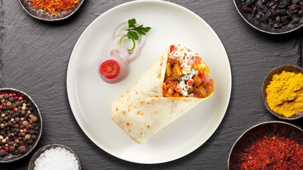 Pasanda Vision Burrito · Cheese cubes marinated in yogurt and spices cooked in tomato sauce wrapped in a warm Naan.