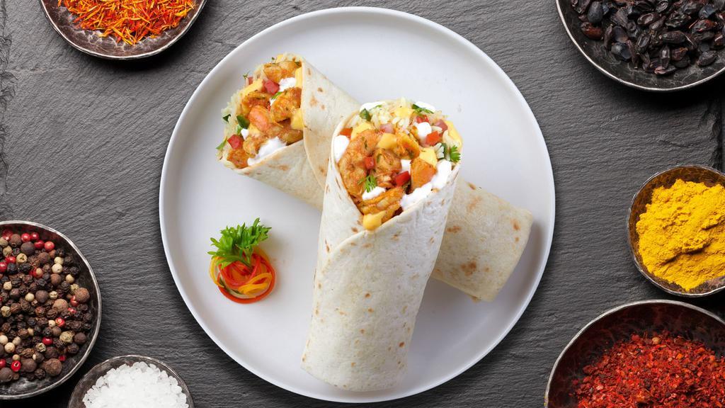 Tikka Away My Shrimp Burrito · Shrimp sauteed with bell pepper and onion in a spiced tomato sauce wrapped in a warm Naan.