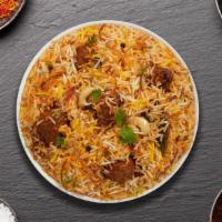Goat Biryani (With Egg) · Basmati rice cooked with goat in a blend of herbs, nuts, eggs, and saffron.