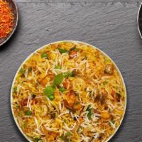 Vegetable Biryani · Spiced seasoned vegetables cooked with Indian spices and basmati rice.