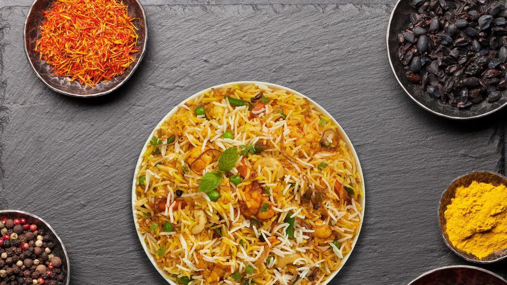 Vegetable Biryani · Spiced seasoned vegetables cooked with Indian spices and basmati rice.