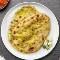 Paneer Naan · Freshly baked bread stuffed with cottage cheese cooked in a clay oven.