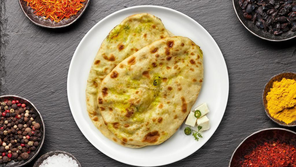 Paneer Naan · Freshly baked bread stuffed with cottage cheese cooked in a clay oven.