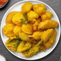 Gotta Veggie Pakora · Assorted vegetables dipped in a light batter and fried until golden brown.