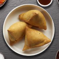Sissy Samosas · (Two pieces) Spicy seasoned potatoes and peas mixed in a curry marinate & fried in a crispy ...