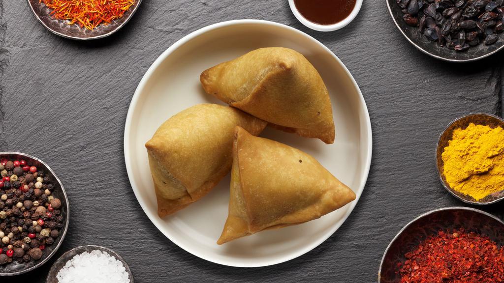 Sissy Samosas · (Two pieces) Spicy seasoned potatoes and peas mixed in a curry marinate & fried in a crispy wheat layer.